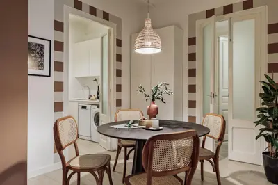 a living room with a couch and a mirror at Sinan - 2 bedrooms and balcony in Sant Gervasi in Barcelona