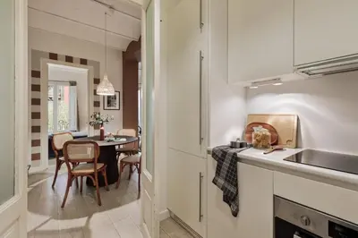 a white bathroom with a toilet and a sink at Sinan - 2 bedrooms and balcony in Sant Gervasi in Barcelona