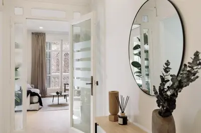 a living room with a couch and a table at Costa - 3 bedrooms, balcony in Eixample Esquerra in Barcelona