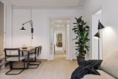a living room with a table and a dining room at Costa - 3 bedrooms, balcony in Eixample Esquerra in Barcelona