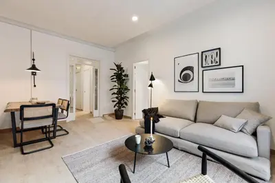a living room with a couch and a table at Costa - 3 bedrooms, balcony in Eixample Esquerra in Barcelona