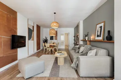 a living room with a couch and a table at Iztapa - 4 bedrooms in Eixample Esquerra in Barcelona