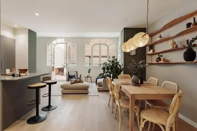 a bedroom with a large bed with two lamps at Peten - 3 bedrooms, terrace and balcony in Gràcia in Barcelona