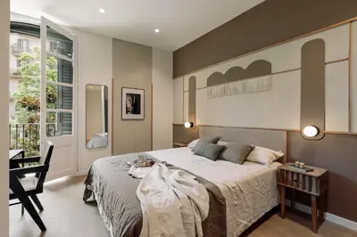 an open kitchen and living room with a couch at Peten - 3 bedrooms, terrace and balcony in Gràcia in Barcelona