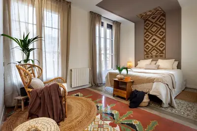 a kitchen with white cabinets and a rug at Natuna - 3 bedrooms in Eixample Esquerra in Barcelona