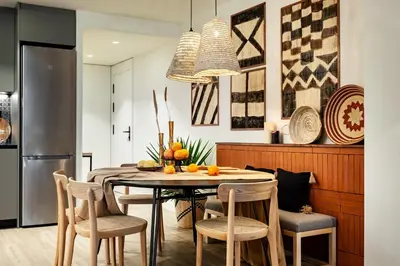 a living room with a table with fruit on it at Nema - 3 bedrooms balcony in Eixample Esquerra in Barcelona
