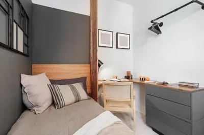 a bedroom with a bed with a book on it at Aura - 3 bedrooms and terrace in Sant Gervasi in Barcelona