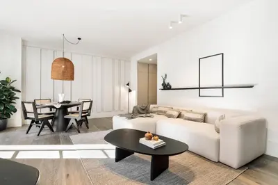 a bedroom with a white bed and a mirror at Fiore - 2 bedrooms in Ciutat Vella in Barcelona