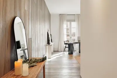 a living room with a couch and a table at Fiore - 2 bedrooms in Ciutat Vella in Barcelona