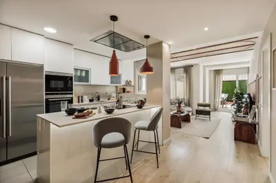 a kitchen with a large island with bar stools at Malena - 3 bedrooms and terrace in Eixample Esquerra in Barcelona