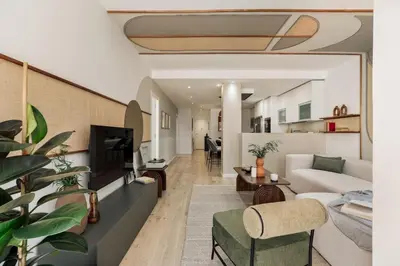 a bedroom with a bed and a large mirror at Malena - 3 bedrooms and terrace in Eixample Esquerra in Barcelona