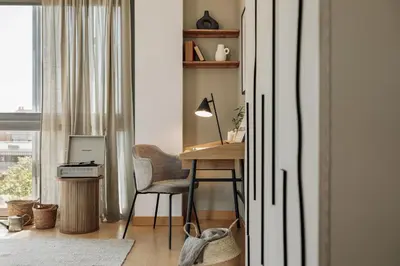 a living room with a table and a couch at Altos - 2 bedrooms in El Poblenou in Barcelona