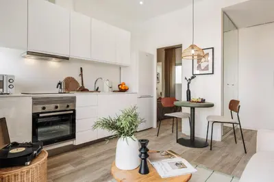 a living room with a couch and a large window at Guacimal - 1 bedroom and terrace in Sants in Barcelona