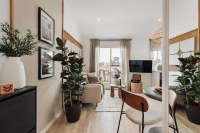 a patio with chairs and a table on a roof at Guacimal - 1 bedroom and terrace in Sants in Barcelona