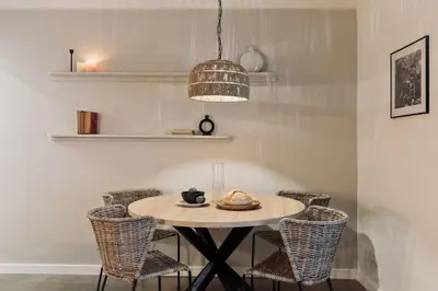 a dining room table with chairs and a pendant light at Poblet - 2 bedrooms and balcony in Poblenou in Barcelona