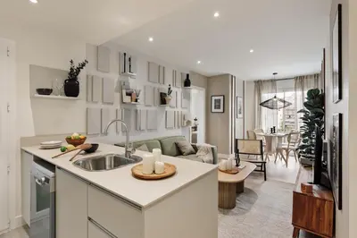 a kitchen with a sink and a living room at Champey - 2 bedrooms and balcony in Sant Gervasi in Barcelona