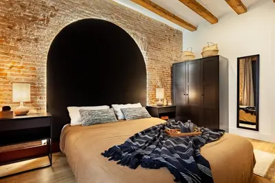 a dining room with a black table and chairs at Annamer - 2 bedrooms and terrace in El Born in Barcelona