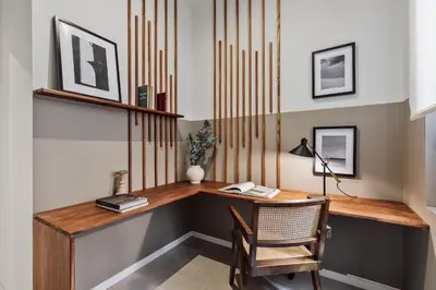 a living room with a couch and a bed at Paleo - 2 bedrooms and office in Eixample Dreta in Barcelona