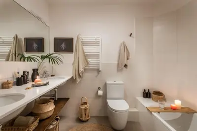 a bedroom with a bed with a book on it at Gili - 2 bedrooms and terrace in Eixample Dreta in Barcelona