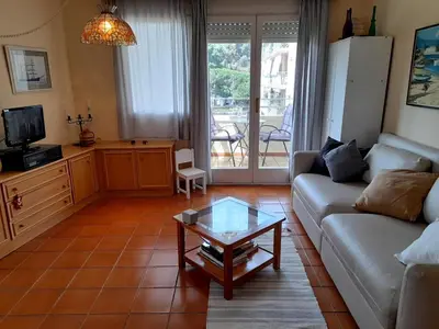 a living room with a couch and a coffee table at Canet playa in Canet de Mar