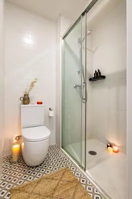a bathroom with a toilet and a glass shower at Faya - 1 bedroom and balcony in Gràcia in Barcelona