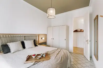 a living room with a couch and a table at Atrani - 3 bedroom in Eixample Dreta in Barcelona