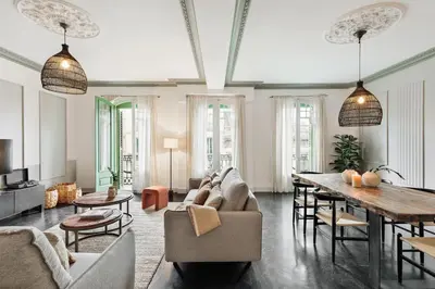 a bedroom with a large bed with a wooden headboard at Valls - 2 bedrooms and office in Gràcia in Barcelona