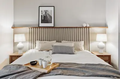 a bedroom with a bed with a tray on it at Valls - 2 bedrooms and office in Gràcia in Barcelona