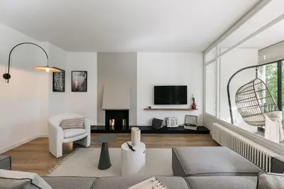 a bedroom with a large bed with a large window at Delfino - 4 bedrooms in Sant Gervasi in Barcelona