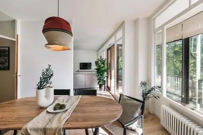 a hallway with glass doors and a dining room at Delfino - 4 bedrooms in Sant Gervasi in Barcelona