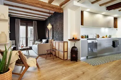 a kitchen and living room with a kitchen and a living room at Anfa - 2 bedrooms in El Born in Barcelona