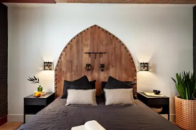 a bedroom with a bed and a large window at Anfa - 2 bedrooms in El Born in Barcelona
