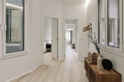 a bathroom with a toilet and a glass shower at Grotta - 3 bedrooms in Sant Gervasi in Barcelona