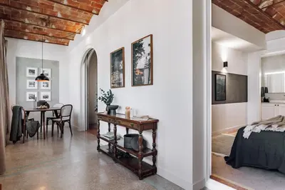 an archway leading into a dining room with a table at Balai - 2 bedrooms in Eixample Dreta in Barcelona
