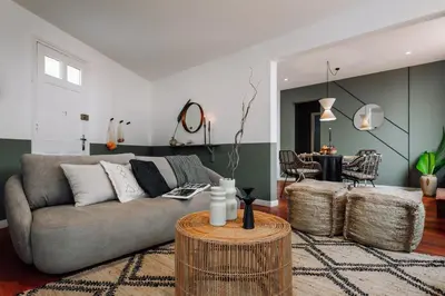 a patio with chairs and an umbrella on a roof at Kambove - 2 bedrooms in Eixample Dreta in Barcelona