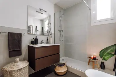 a kitchen with a sink and a stove top oven at Kambove - 2 bedrooms in Eixample Dreta in Barcelona