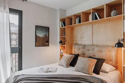 a living room with a table and a couch at Aneto - 3 bedrooms in Eixample Esquerra in Barcelona