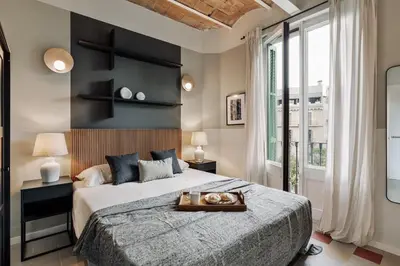 a kitchen and dining room with a dining table at Andy - 2 bedrooms and office and balcony in Eixample Dreta in Barcelona