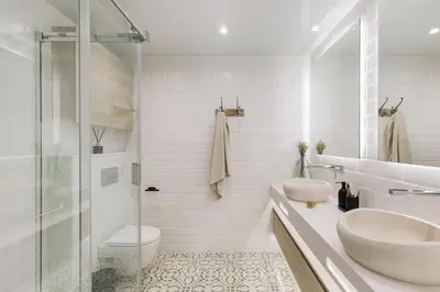 a white bedroom with a bed and a window at Maiori - 2 bedrooms and terrace in Sant Gervasi in Barcelona