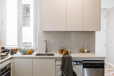 a dining room with a wooden table and chairs at Senahu - 2 bedrooms and office in Eixample Dreta in Barcelona