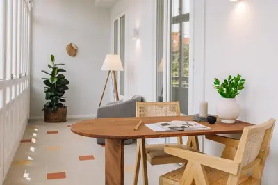 a living room with a couch and a table at Senahu - 2 bedrooms and office in Eixample Dreta in Barcelona
