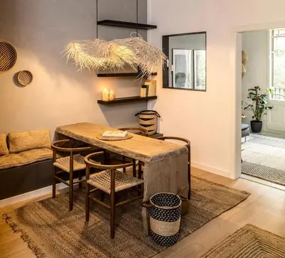 a dining room with a wooden table and chairs at Tambo - 2 bedrooms in Eixample Esquerra in Barcelona