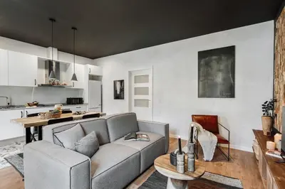 a living room with a couch and a table at Dorria - 3 bedrooms in Eixample Dreta in Barcelona