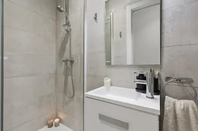 a living room with a flat screen tv on a entertainment center at Dorria - 3 bedrooms in Eixample Dreta in Barcelona