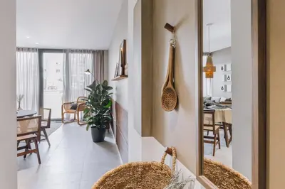 a room with white walls and a basket on the wall at Ohanes - 2 bedrooms in Eixample Esquerra in Barcelona