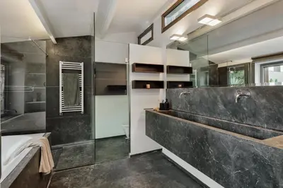 a living room with a fireplace and a skylight at Damat - 4 bedrooms and terrace in Sarrià in Barcelona