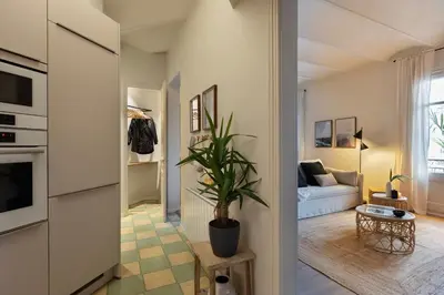 a dining room with a table and chairs at Muari - 2 bedrooms in Eixample Esquerra in Barcelona