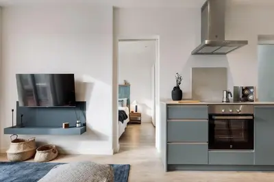 a living room with a couch and a table at Banchina - 1 bedroom and terrace in Sant Gervasi in Barcelona