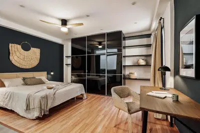a black table and benches on a patio at Quemu - 2 bedrooms in Eixample Esquerra in Barcelona
