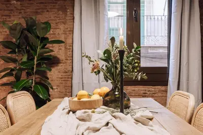 a room with a bed and a desk and shelves at Ubrique - Studio in El Born in Barcelona